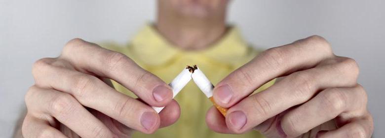 man breaking cigarette image